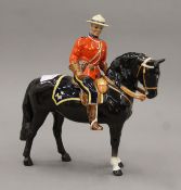 A Beswick Mountie on horseback. 20.5 cm high.