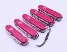 Five various Swiss Army penknives. The largest 9 cm long closed.
