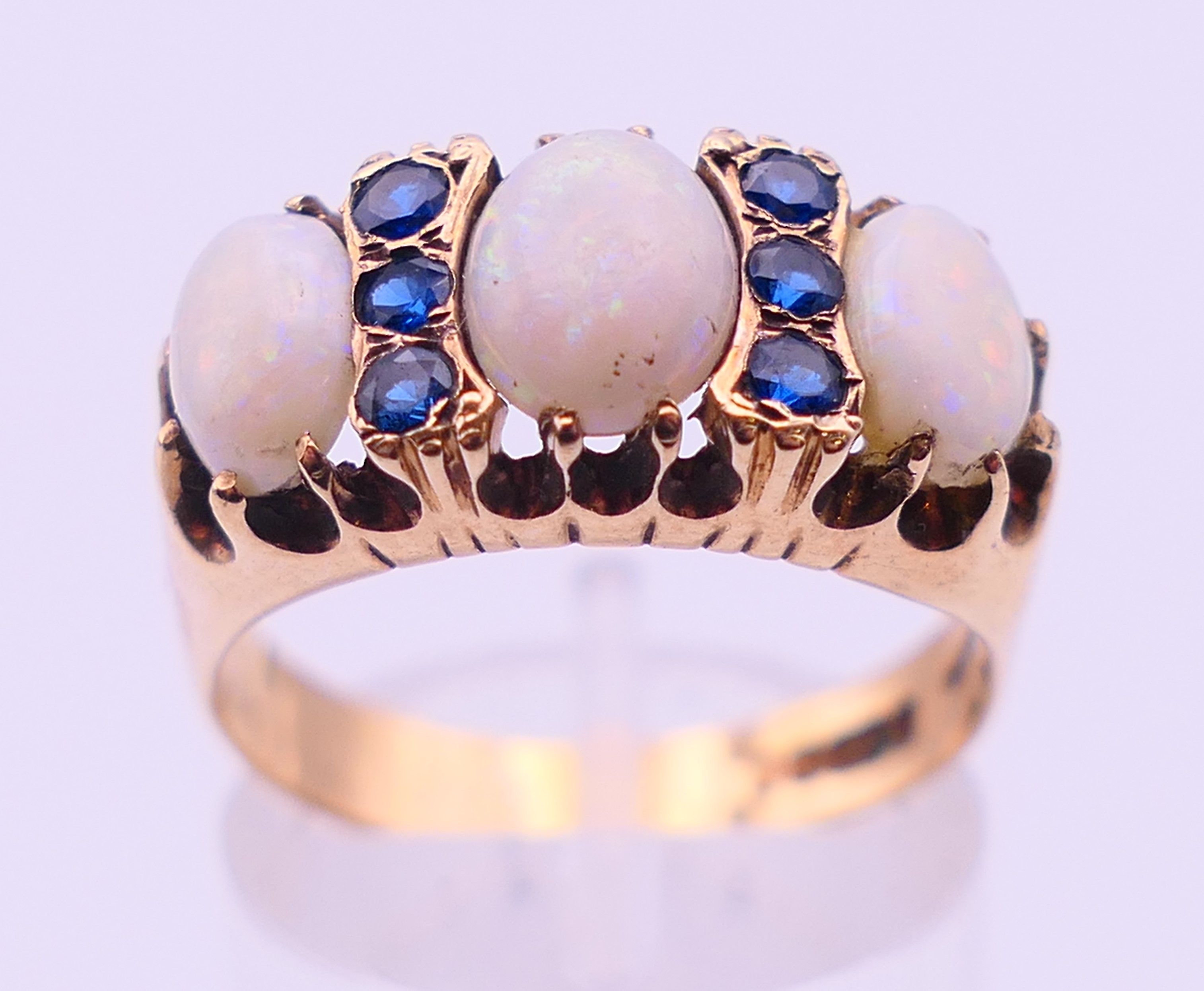 A 9 ct gold, opal and sapphire ring. Ring size Q. 4.8 grammes total weight. - Image 2 of 5