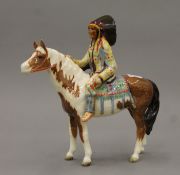 A Beswick Native American Indian on horseback. 21.5 cm high.