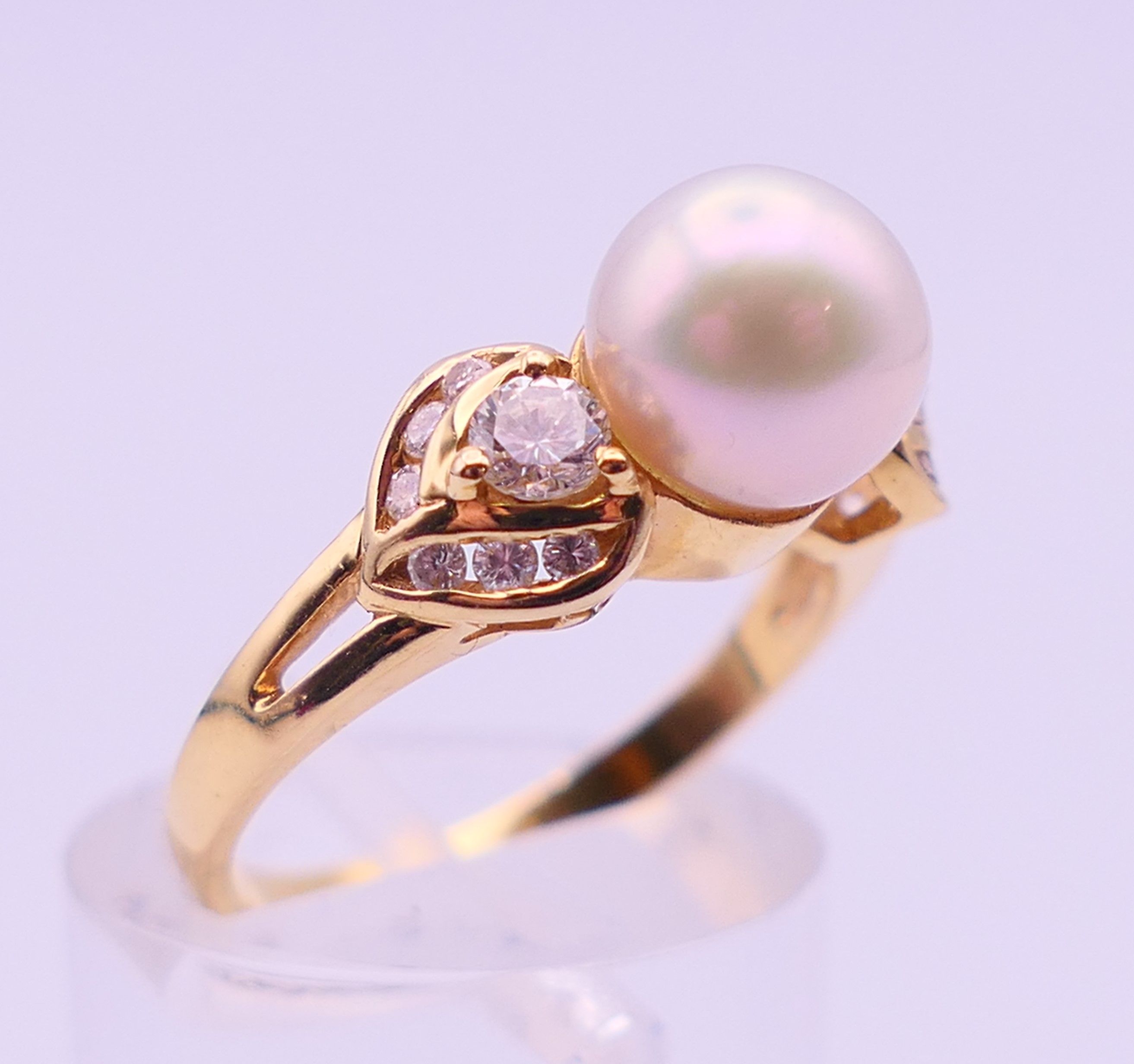 An 18 ct gold, diamond and pearl ring. Ring size L/M. 3.9 grammes total weight. - Image 3 of 5