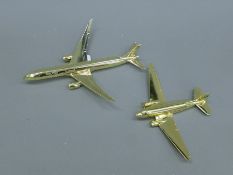 Two Saudi Arabian Airline model planes. The larger 23 cm long.