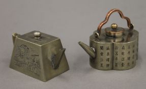 Two small Chinese white metal teapots. The larger 8.5 cm long.