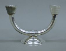 A Christofle silver-plated twin-branch candlestick. 13 cm high.