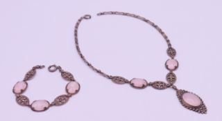 A silver and rose quartz necklace and matching bracelet/extension piece. The former 40 cm long.