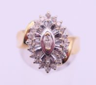 A 10 K gold navette shaped multi-diamond ring. Ring size N.
