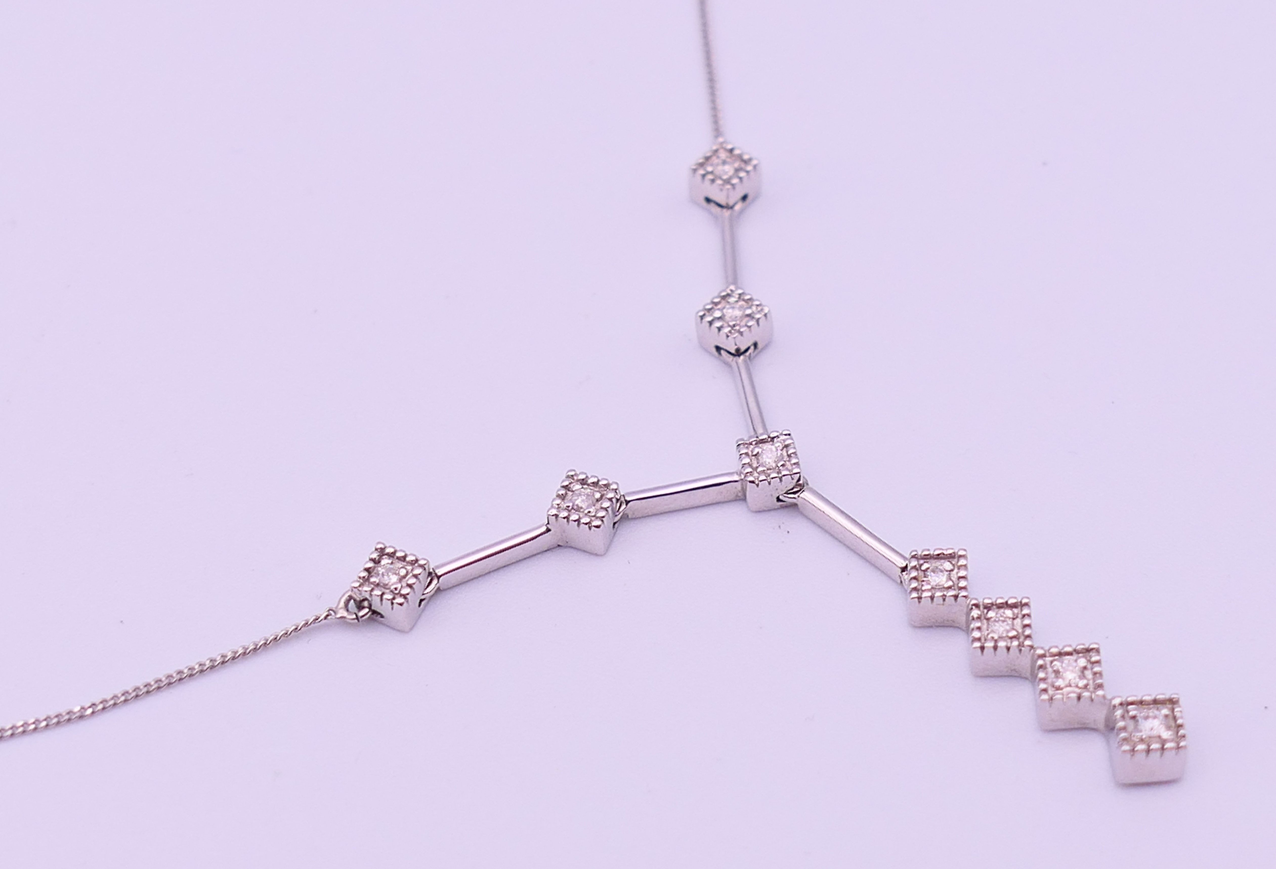 A 9 ct white gold and diamond pendant necklace. Pendant drop 3 cm high, chain 45 cm long. 3. - Image 5 of 8