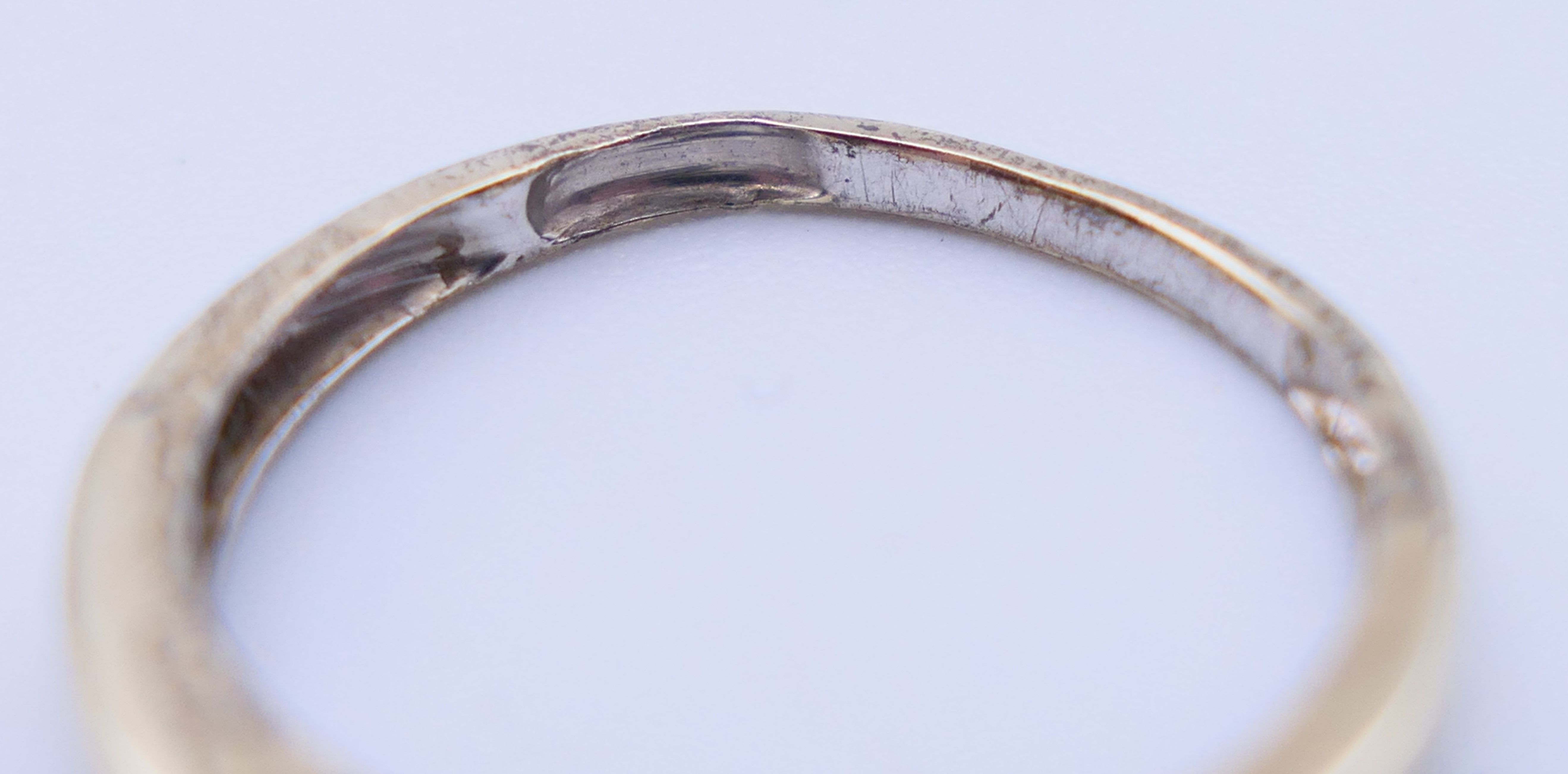 A 9 ct gold three-stone ring and an unmarked half hoop eternity ring. The former, Ring size M and 3. - Image 5 of 11
