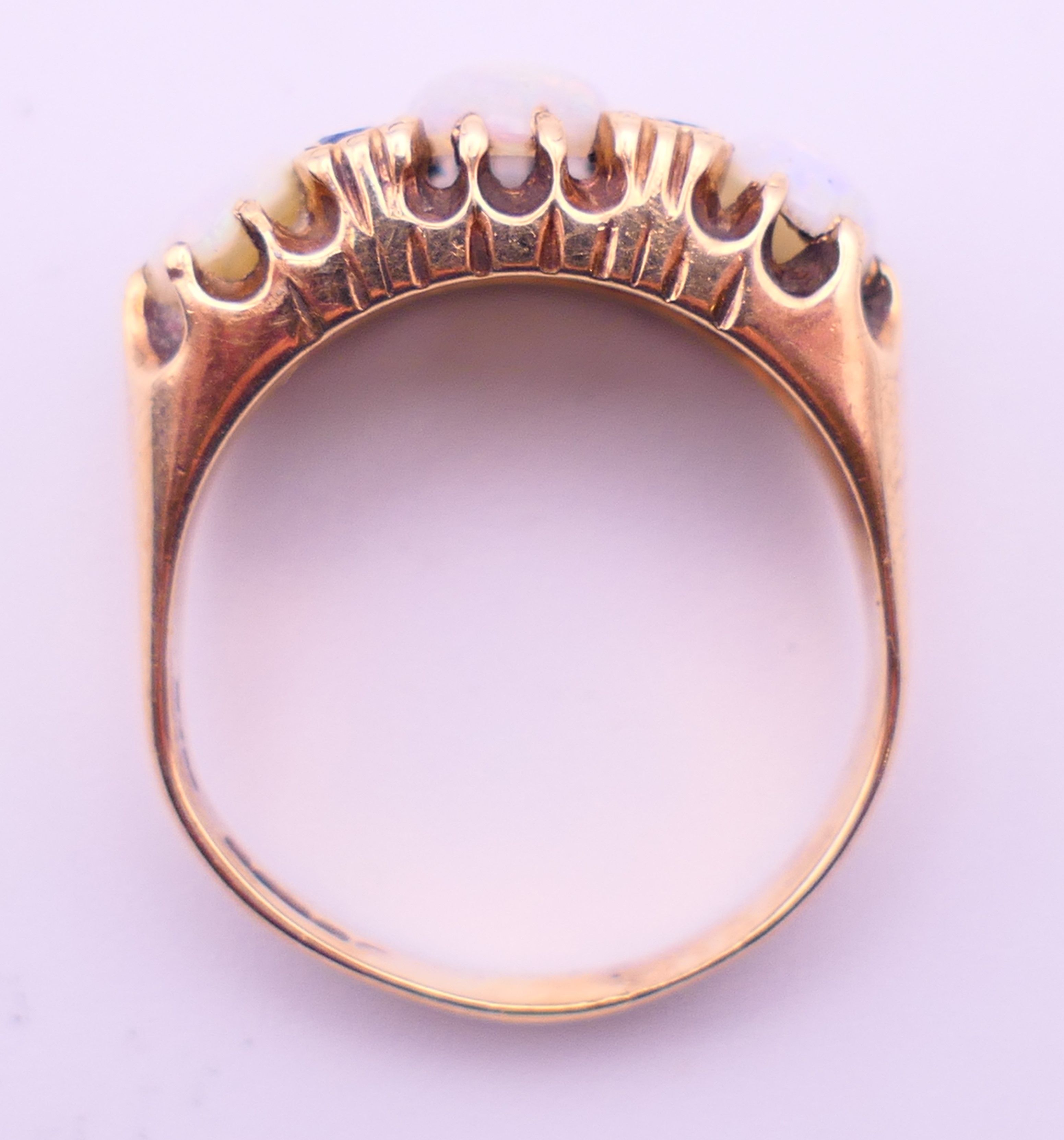 A 9 ct gold, opal and sapphire ring. Ring size Q. 4.8 grammes total weight. - Image 5 of 5
