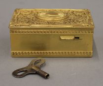 A gilt bronze singing bird automaton music box. 10.5 cm wide.