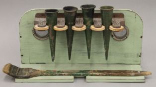 A vintage paintbrush rack. 41 cm wide.