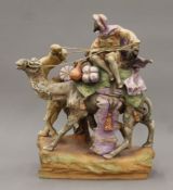 An Amphora porcelain Arab and camel group. 38.5 cm high.
