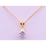 A diamond set gold pendant on an 18 ct gold chain.