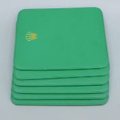 Six Rolex place mats. 23.5 x 19.5 cm.