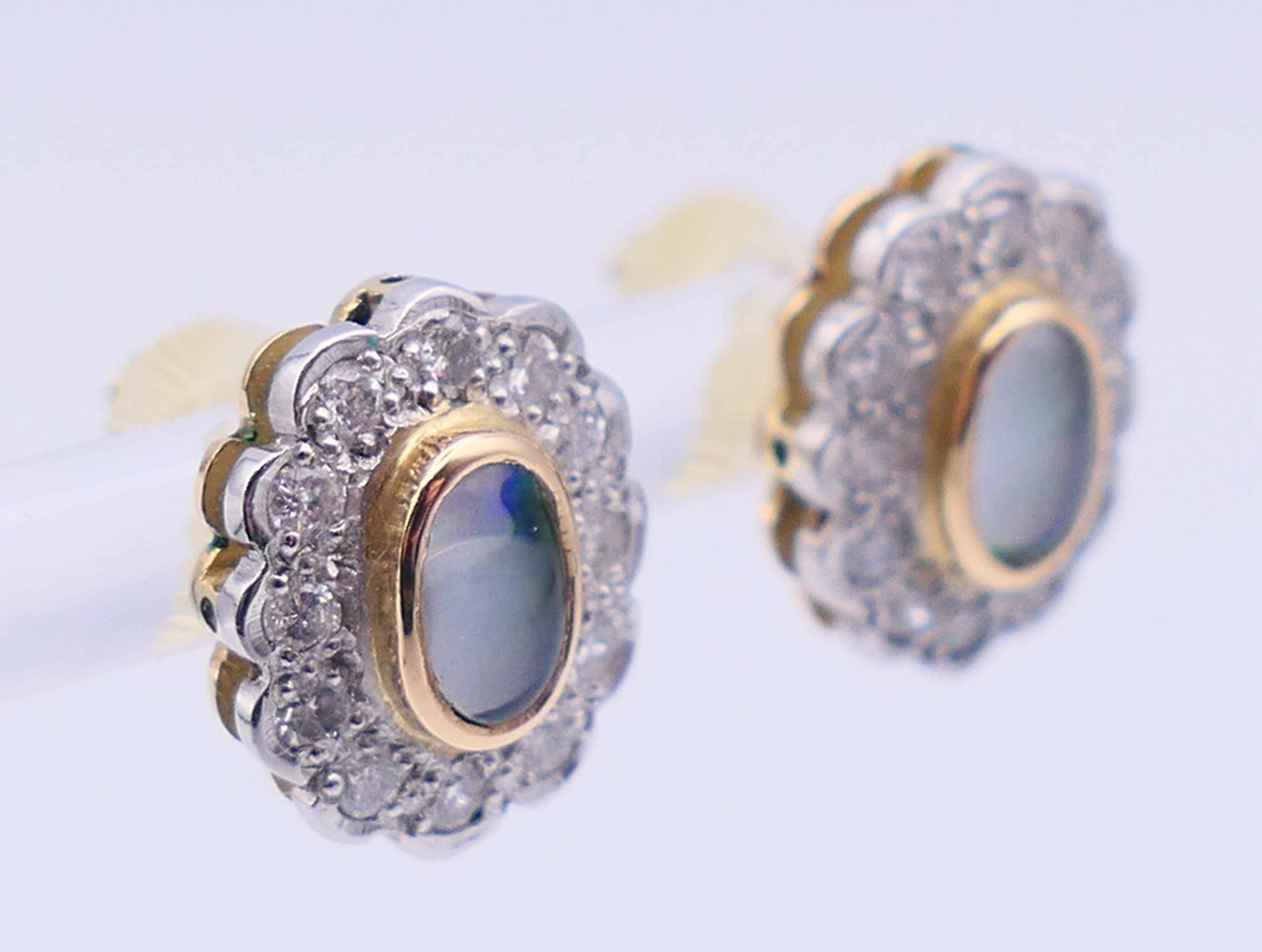 A pair of unmarked gold, diamond and opal earrings. 1.25 cm high. - Image 2 of 6
