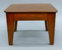 A 19th century mahogany stool. 22 cm wide x 16 cm high.