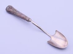 A Georgian silver cheese scoop. 18.5 cm long.