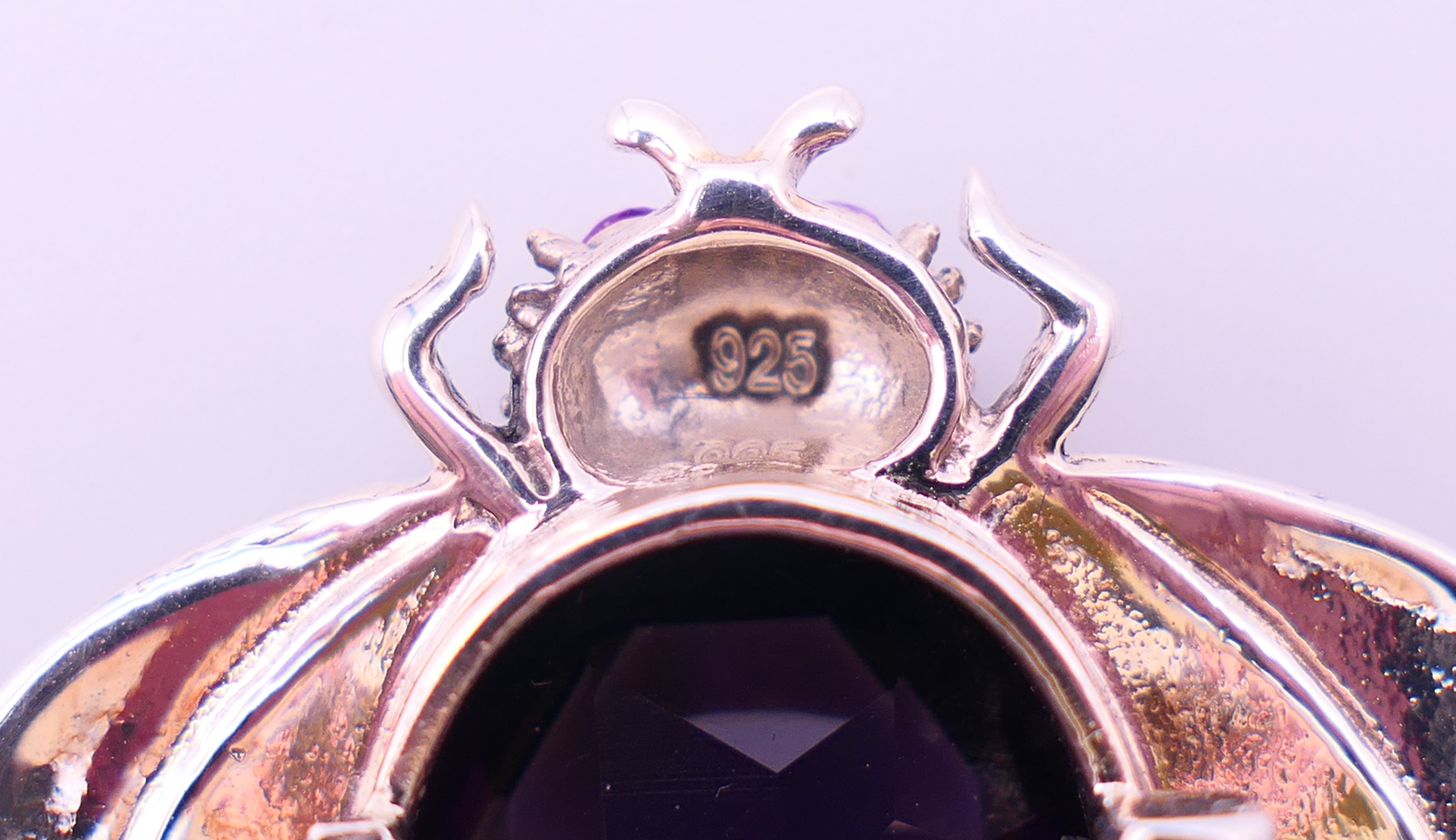 A silver bee form brooch with purple stone body and pink stone inset eyes. 3.5 cm high. - Image 4 of 4