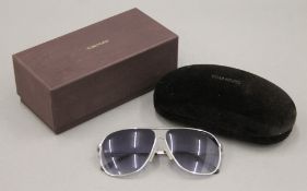 A boxed pair of Tom Ford sunglasses. The box 18 cm wide.