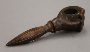 A 19th century treen hand-form nut cracker. 17.5 cm long.