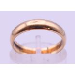 A 9 ct gold wedding band. Ring size L. 2.3 grammes.