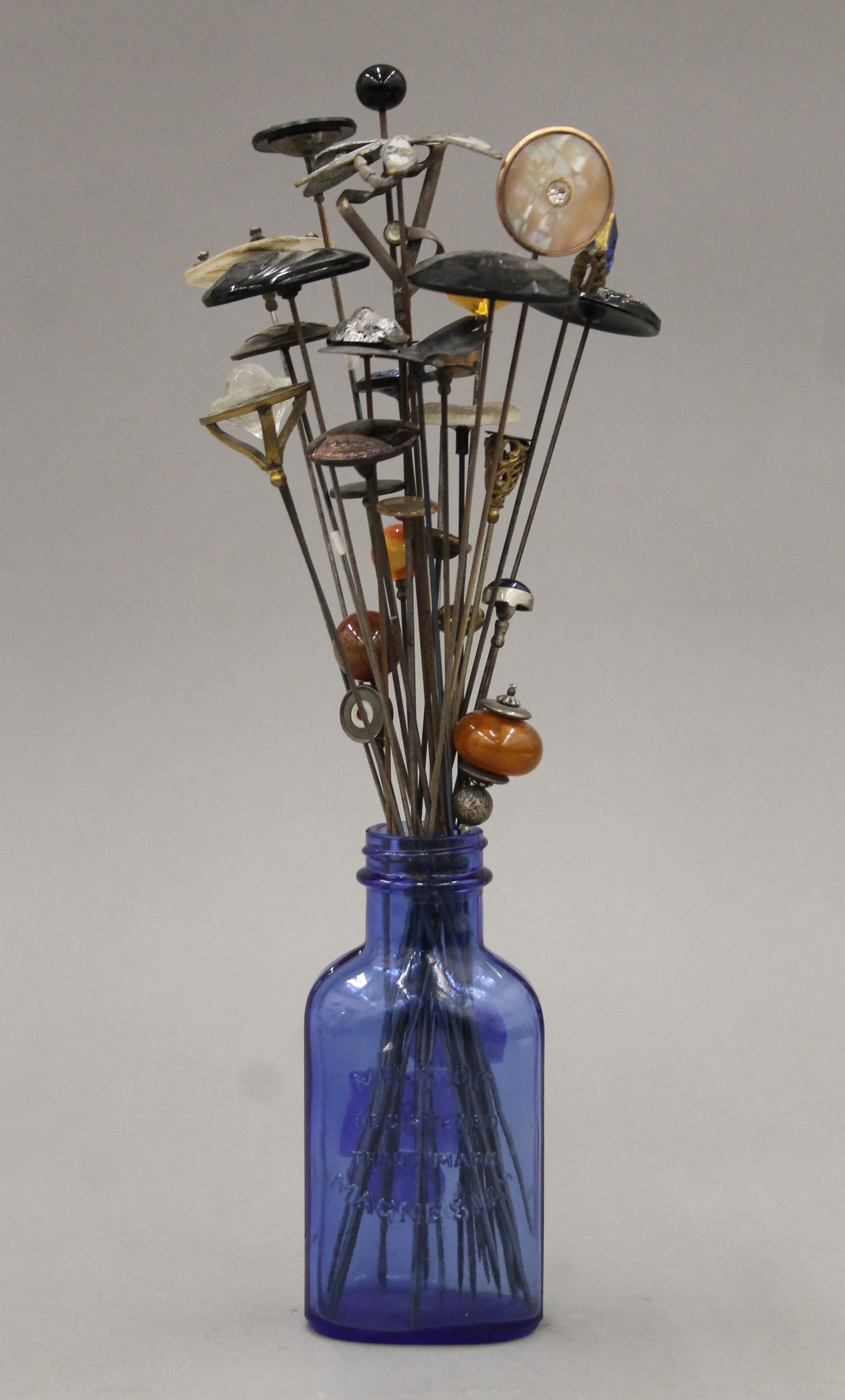 A collection of vintage hat pins. The largest 32 cm long.