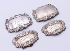 Three silver decanter labels and a plated example. Sherry 5.5 cm wide.