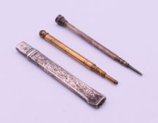 Two propelling pencils and a silver cased pencil. The latter 8 cm long.