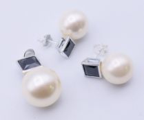 A pair of silver, pearl earrings with a matching pendant. Pendant 2.75 cm high.
