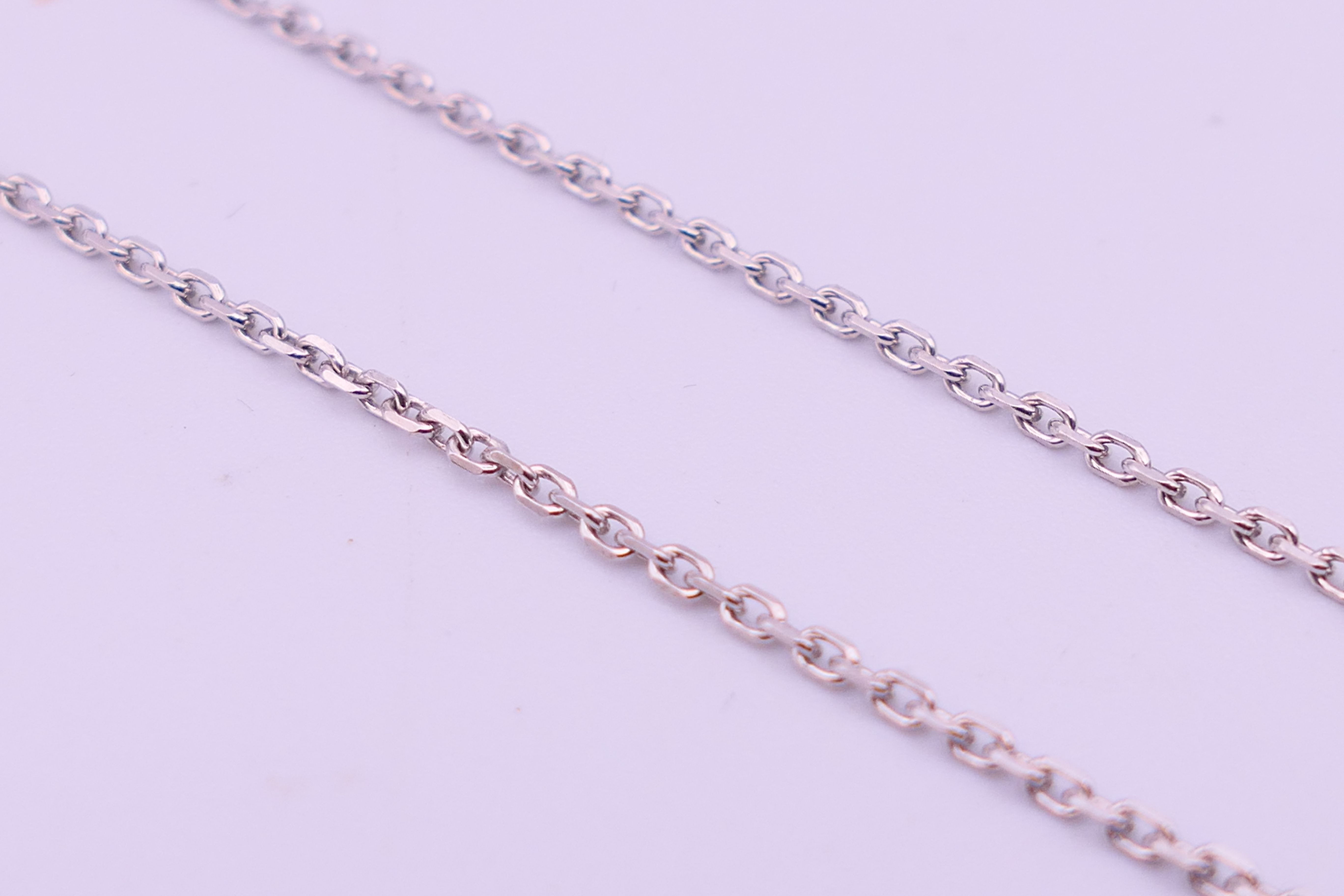 An 18 ct white gold, diamond and pearl drop pendant on a chain. Pendant 2. - Image 5 of 6