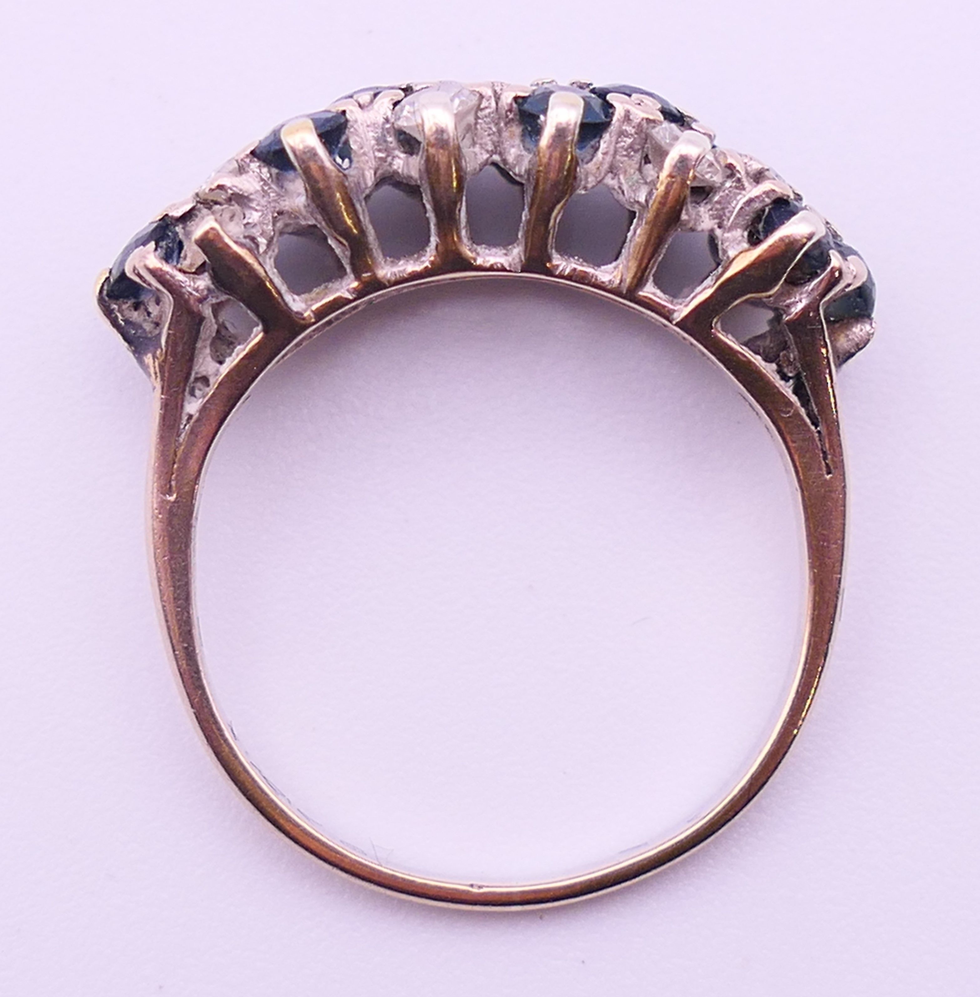 An unmarked white gold or platinum, diamond and sapphire ring. Ring size N. 4 grammes total weight. - Image 5 of 5