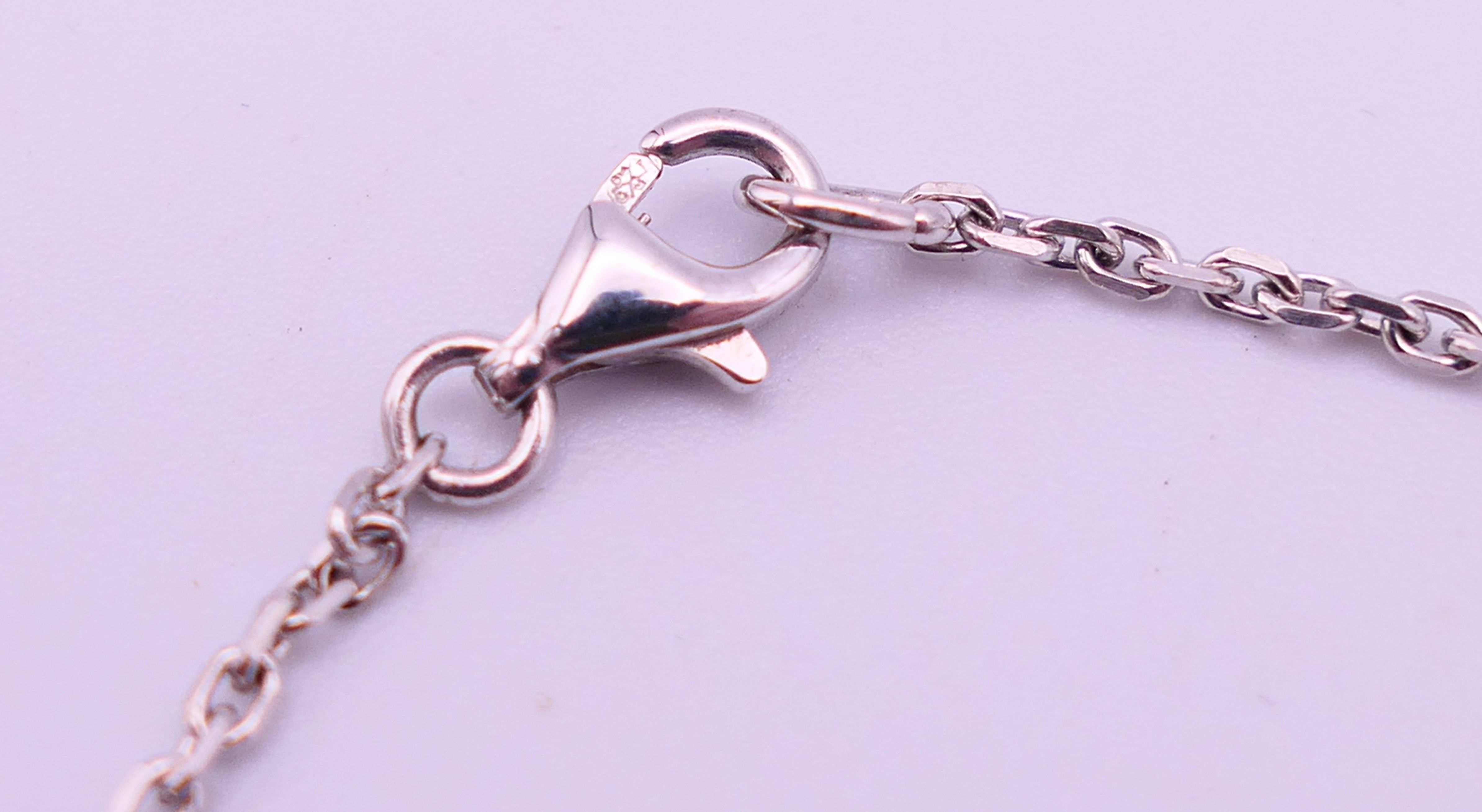 An 18 ct white gold, diamond and pearl drop pendant on a chain. Pendant 2. - Image 4 of 6