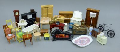 A quantity of dolls' house furniture. The piano 13 cm wide.