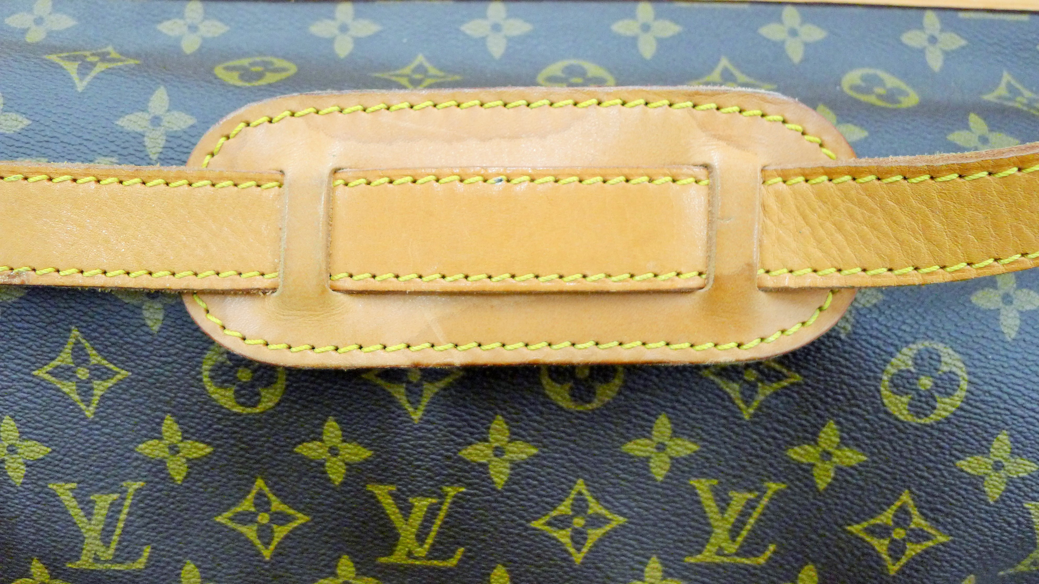 A vintage 1980's Louis Vuitton three-pocket travel bag with leather trim and shoulder strap. - Image 15 of 16