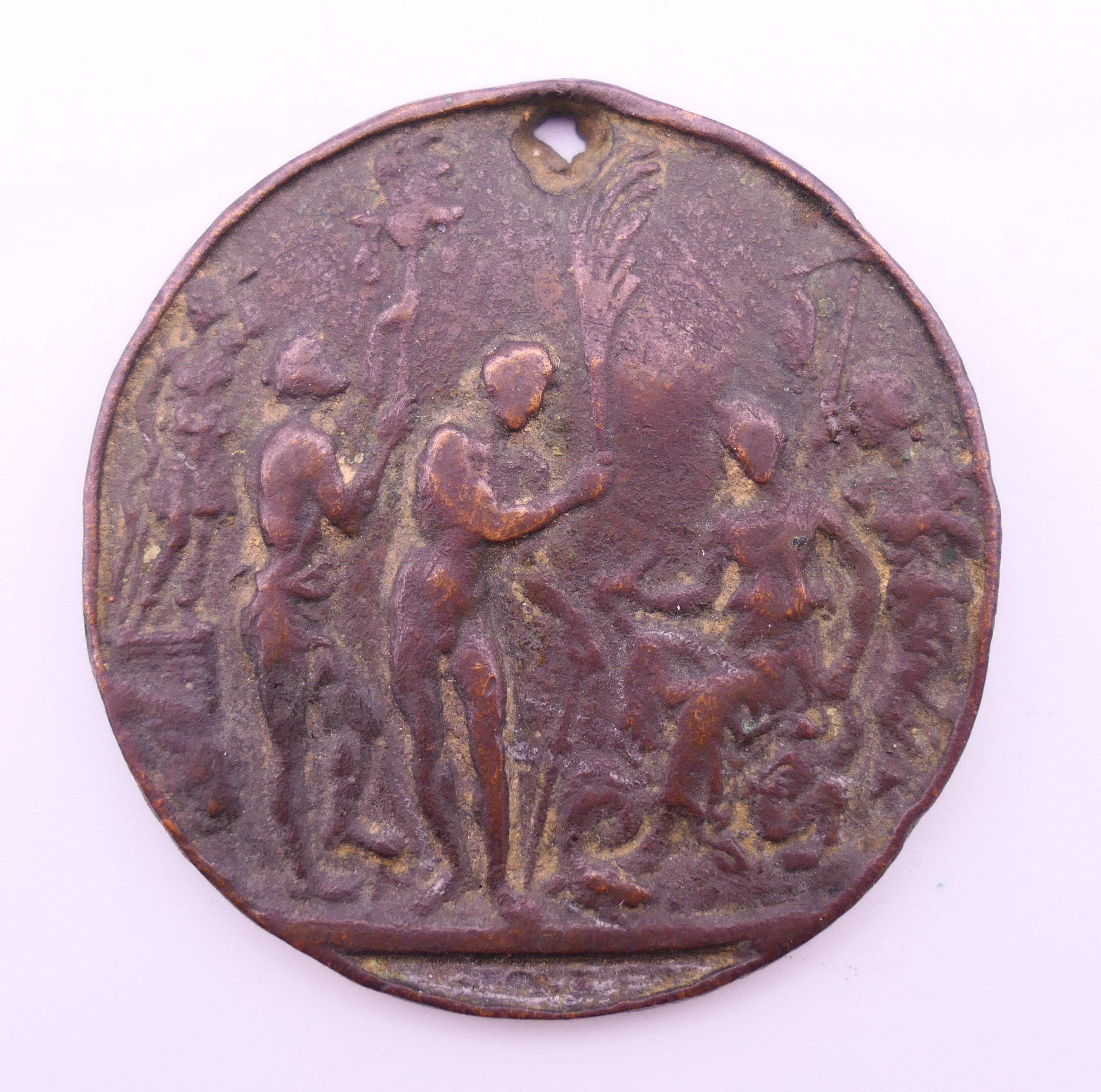 An antique bronze medallion. 5 cm diameter.
