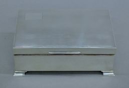 A silver cigarette box. 14.5 cm wide.