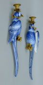 A pair of gilt metal-mounted porcelain parrot wall sconces. Each 48 cm high.