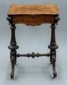 A Victorian walnut work table. 54.5 cm wide.