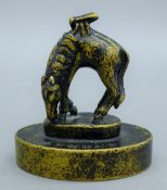 A Chinese bronze seal formed as a horse surmounted with a fly. 7.5 cm high.