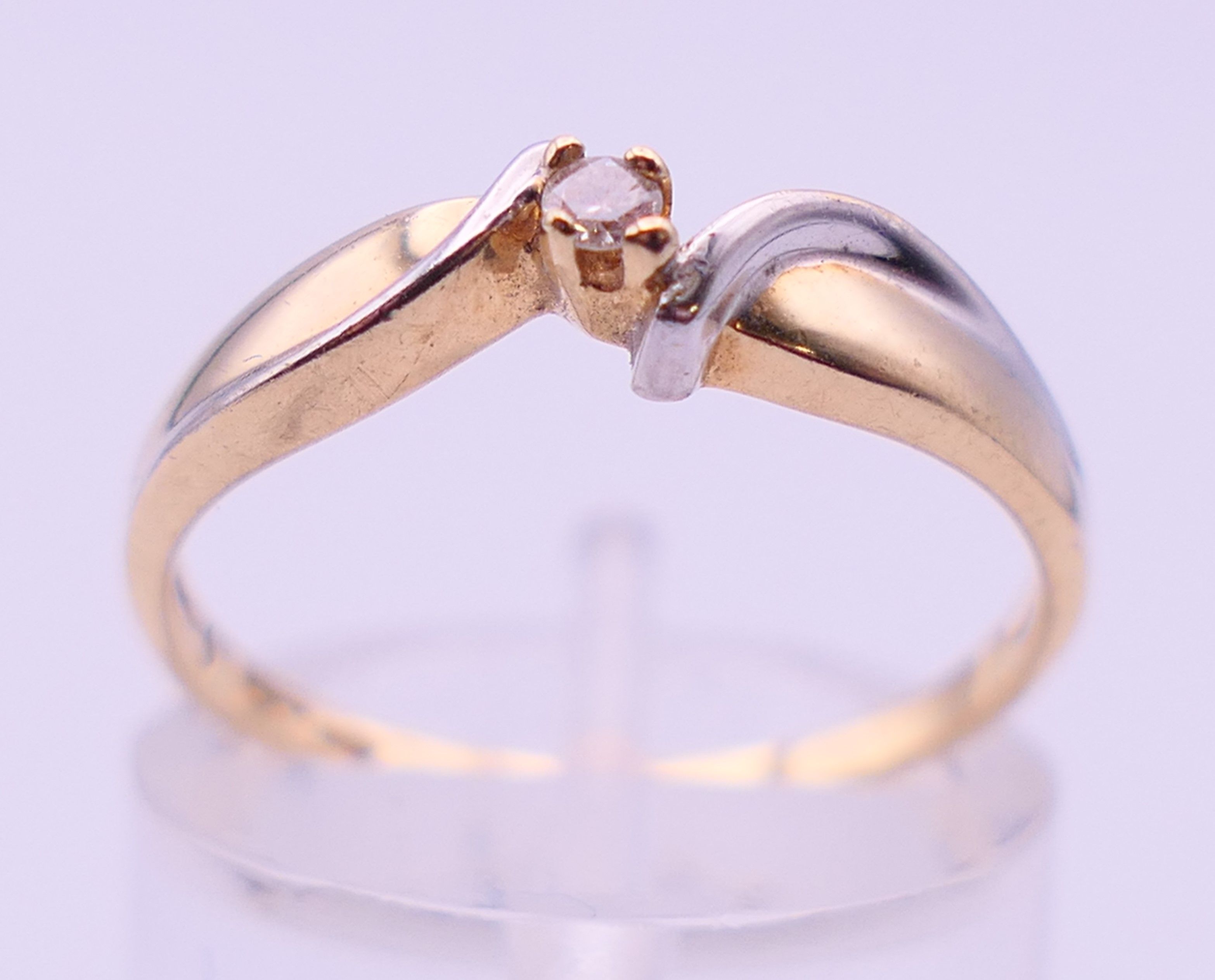 A 10 ct bi-colour gold diamond solitaire ring. Ring size N. 1.6 grammes total weight. - Image 2 of 5