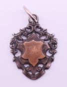 A silver medal fob inscribed CFA 1905-6, the reverse inscribed Senr. Cup, J Gotobed. 4 cm high.