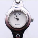 A Gucci ladies' wristwatch. 23 mm diameter including crown.