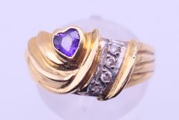 An 18 ct gold dress ring. Ring size Q. 5.3 grammes total weight.