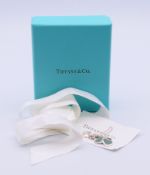 A boxed Tiffany & Co silver double heart tag pendant necklace. Pendants 1.