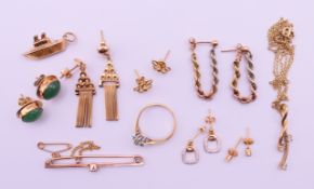 A quantity of 9 ct gold jewellery including earrings, a ring, a steamship charm/pendant,