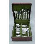 A canteen containing an eight piece table setting of Birks engraved silver flatware.