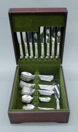 A canteen containing an eight piece table setting of Birks engraved silver flatware.