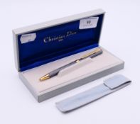 A boxed Christian Dior ballpoint pen. 13.5 cm high.