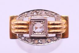 An Art Deco 18 ct gold and diamond ring. Ring size L/M. 5.9 grammes.