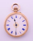 A 14 K gold ladies fob watch. 3.25 cm diameter. 30.4 grammes total weight.